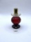 Candle stand with some liquid Avon bottle