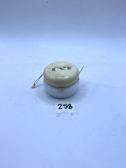Small white Avon bottle