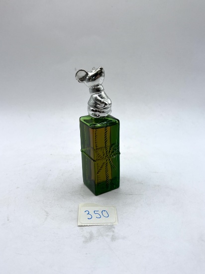 Mouse present with liquid Avon bottle