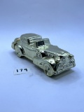Solid gold cadillac Avon bottle