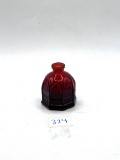 Small red Avon bottle