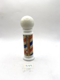 Barber pole with liquid Avon bottle