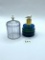 Bird cage with some liquid Avon bottle