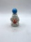 Circus clown with liquid Avon bottle