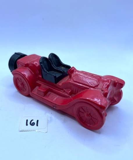 Red tractor with some liquid Avon bottle