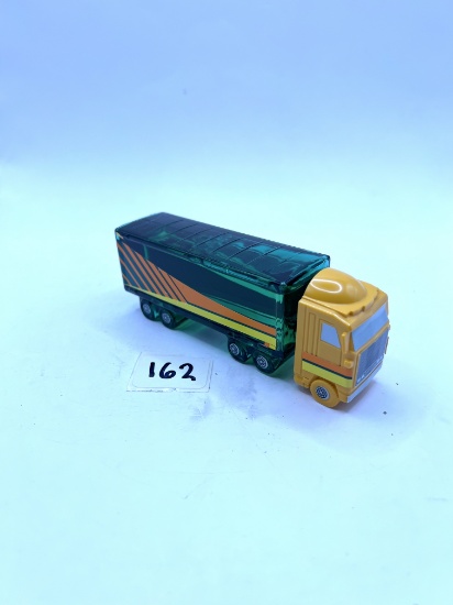Green truck with some liquid Avon bottle