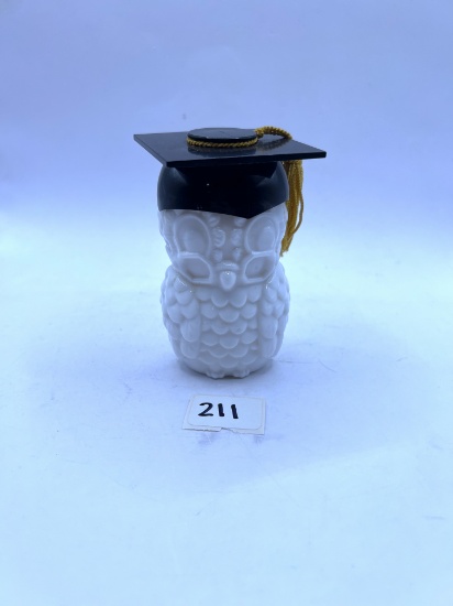 Graduation hat owl with some liquid Avon bottle