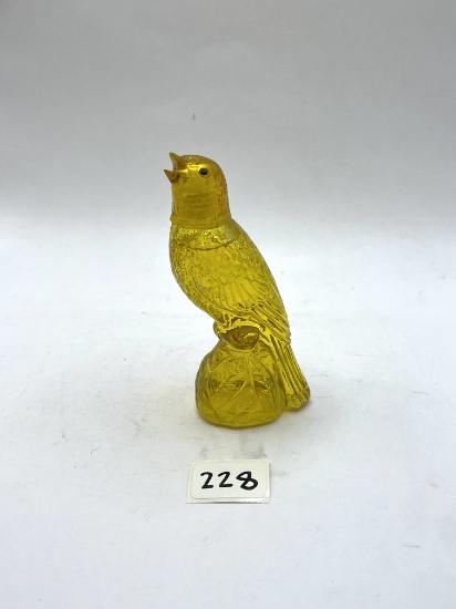 Yellow Parakeet With Some Liquid Avon Bottle