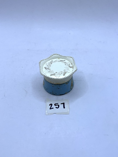 Small blue and white Avon bottle