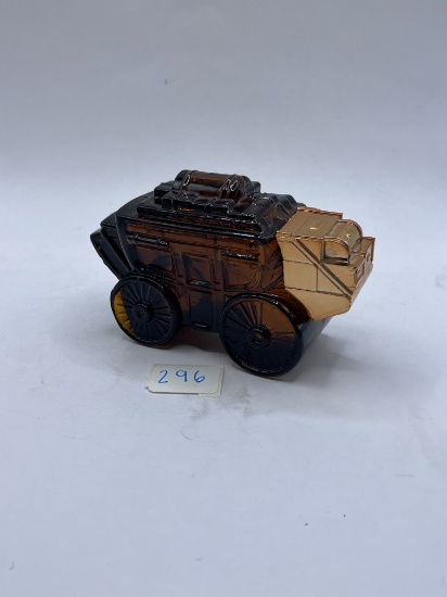 Brown carriage with some liquid Avon bottle