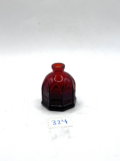 Small red Avon bottle
