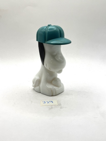 Snoopy with some liquid Avon bottle