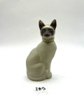 Cat with some liquid Avon bottle