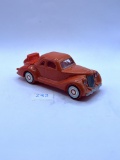Orange car with some liquid Avon botte