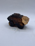 Brown carriage with some liquid Avon bottle