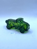 Green truck with some liquid Avon bottle