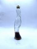 Flamingo decanter with some liquid Avon bottle