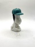 Snoopy with some liquid Avon bottle