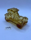 Yellow car with some liquid Avon bottle