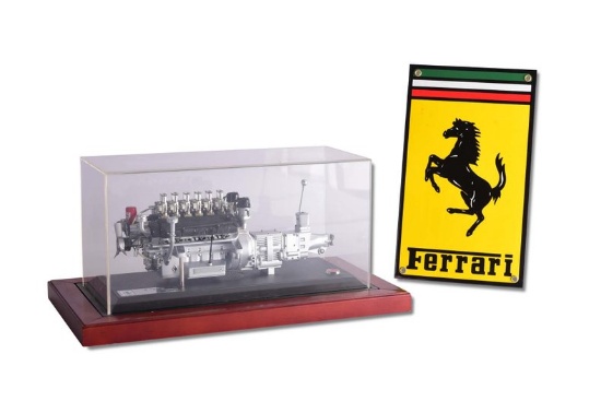 Ferrari Model Engine in Display Case and Small Metal Ferrari Sign