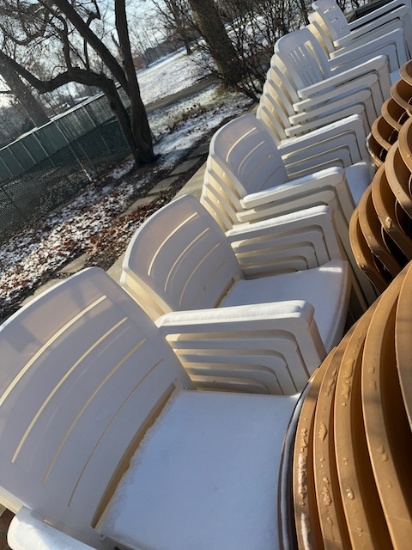 35- White plastic patio chairs