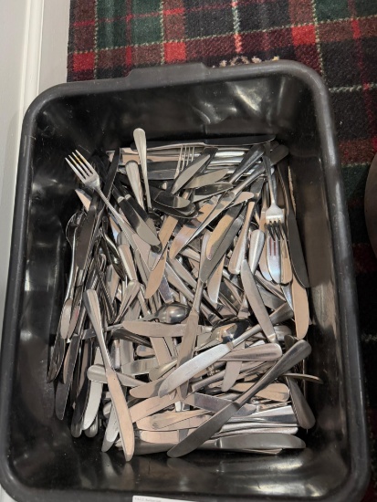 Tote of assorted flatware, mostly butter knives
