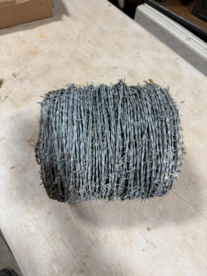 Partial roll of barbed wire
