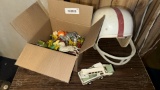 Vintage Football Helmet with Red Stripe and Toy Collection