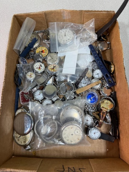 Watch parts for repair, some with Mickey Mouse faces