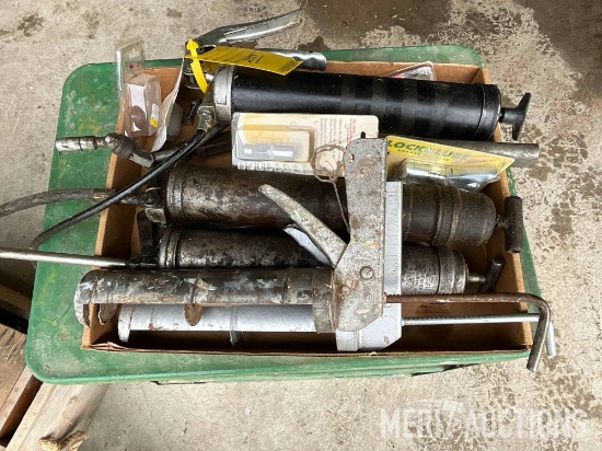 Flat of grease guns, caulking gun & grease tips