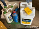 (7) containers of anti-freeze, (5) full, (2) partials