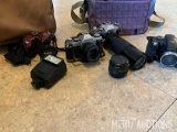 (4) Cameras and (2) Camera Bags