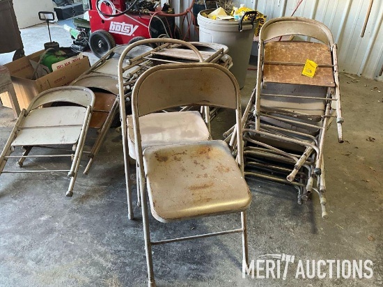 Stack of metal folding chairs