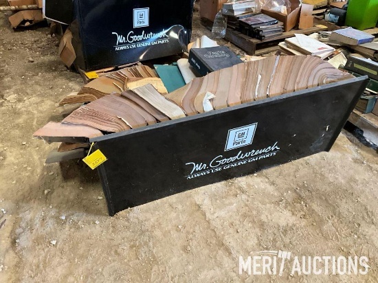 (2) racks of GM Goodwrench parts and repair manuals