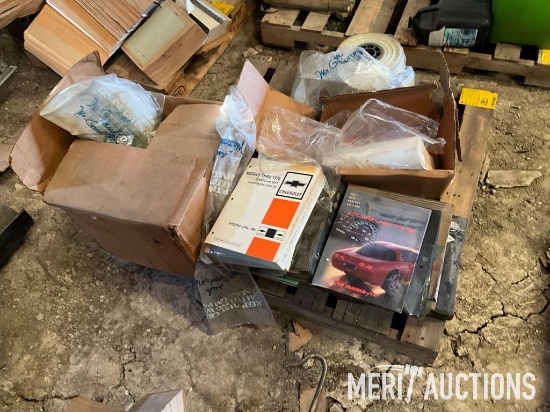 Pallet of GM repair manuals and catalogs, and plastic parts bags