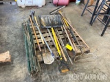 pallet of rakes, shovels, and misc. garden tools