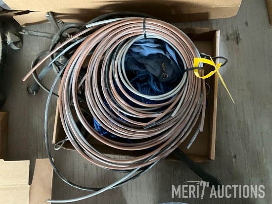 flat of bungee straps and Precision Planting air line