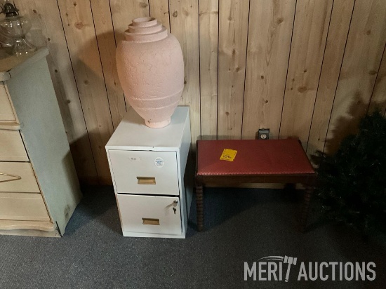 2-drawer metal cabinet with vase and vintage piano bench