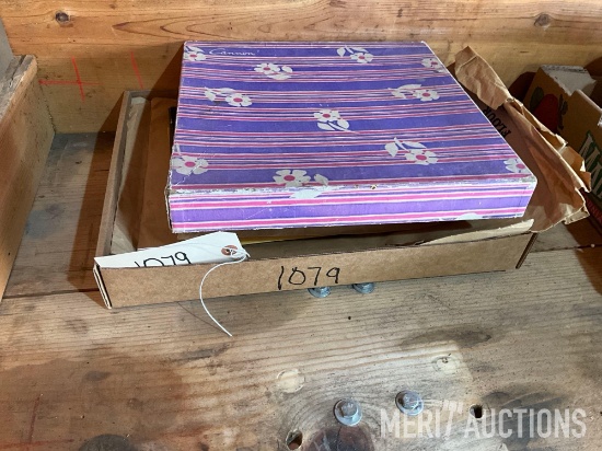 Flat of cut out paper dolls as pictured