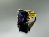 Sterling silver ring with purple emerald cut stone