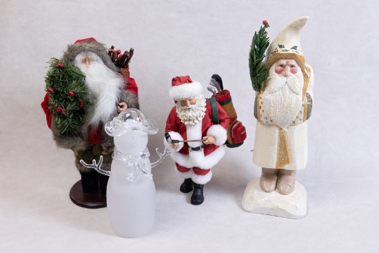 Santa Statues and Glass Snowman