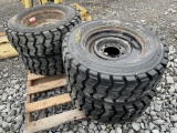 (4) SkidRock 10-16.5 NHS Tires on 8 Lug Rims
