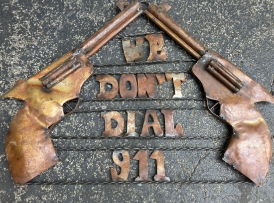 Metal “ We don’t dial 911” sign