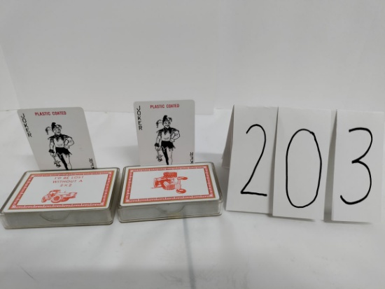 2 decks of playing cards:  "I'd be lost without a 2 x 2" and "86 series tractor"