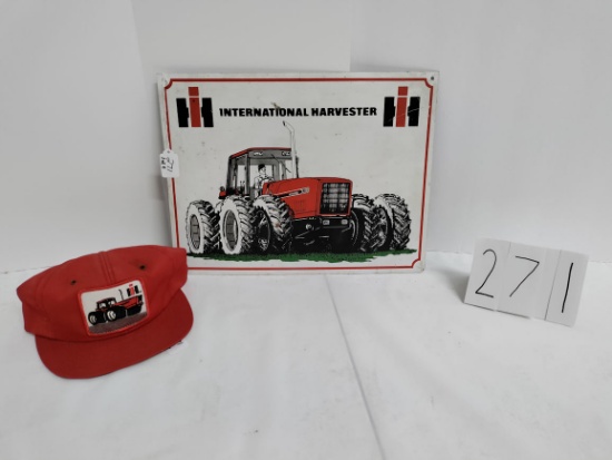 Metal origional 12.75" x 17.75" IH 7488 sign and 7000 series winter truckers hat in fair condition