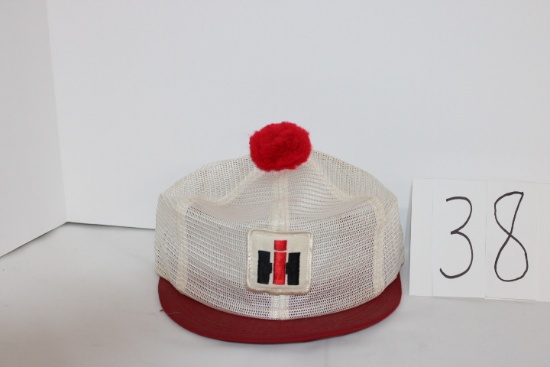 IH Ladies mesh hat with red pom pom and visor