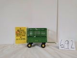 Ertl JD Throw bale wagon with 9 stryofoam bales in good condition and JD pamphlet