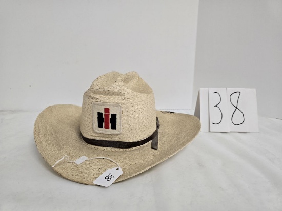 white IH woven cowboy hat size 7 1/8 small amount of black tar on back