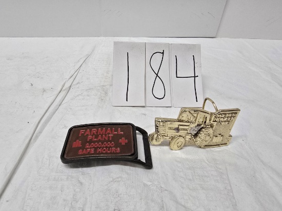 2 IH belt buckles one is Farmall plant 2000000safe hours and other is Speccast