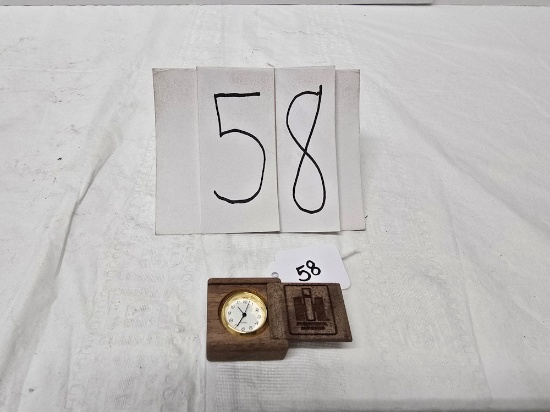 IH wooden box with sliding door inside is quartz clock